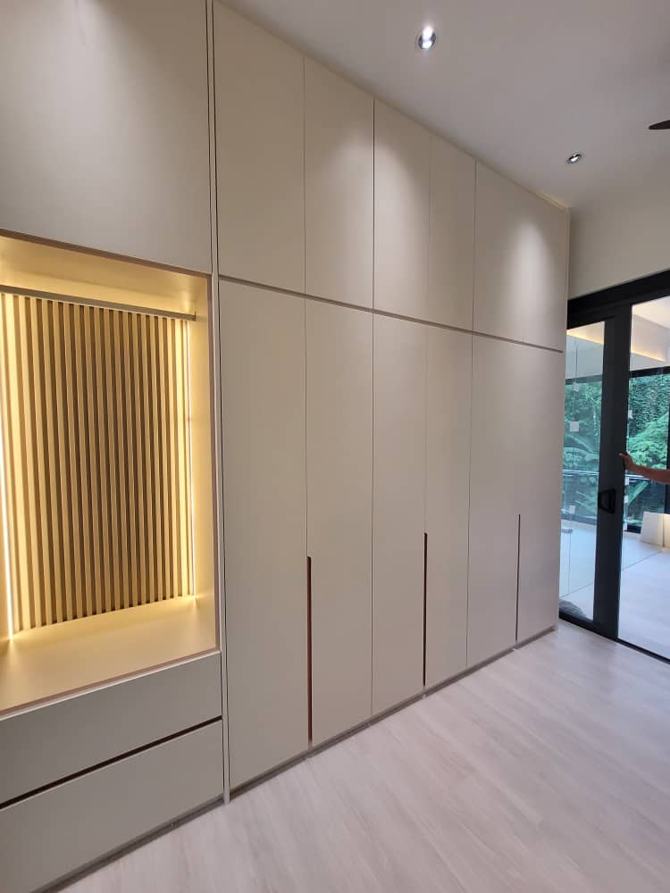 Custom wardrobe with backlit wood slat niche — Lakefield